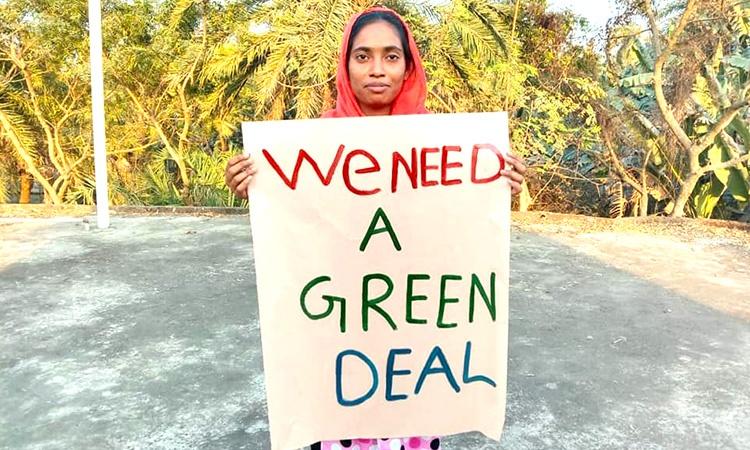 Protester with Green Deal sign